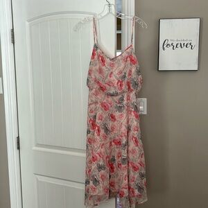 Pinks and grays floral Spaghetti strap dress that hits and knee.